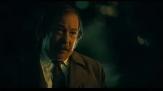 older man with serious expression — Joker