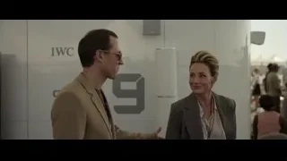 man and woman talking at event — F1