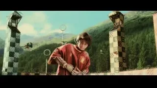 boy in red robe with two towers — Harry Potter and the Philosophers Stone