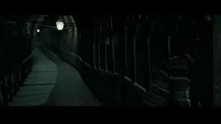 young man in dimly lit tunnel with arches — Harry Potter and the Deathly Hallows 2