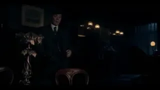 Man in suit standing in dimly lit room — Peaky Blinders