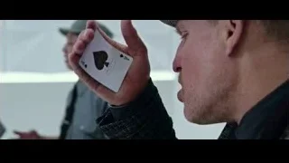 man in fedora holding skull card — Now You See Me 2