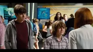 Two young boys in crowded room — Jurassic World