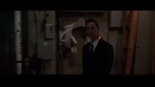 man in suit walking dark hallway — Steve Jobs