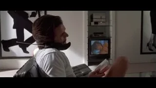 person with neck brace reading in living room — American Psycho