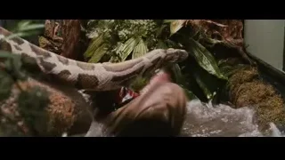 Young boy holding large snake — Harry Potter and the Philosophers Stone