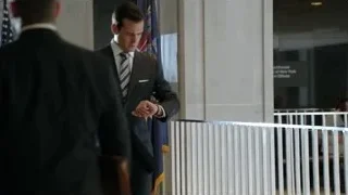 Man in suit walking in hallway — Suits