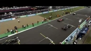 Multiple cars racing on track with crowd — F1