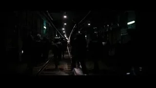 People walking on railway track at night — Batman: The Dark Knight Rises