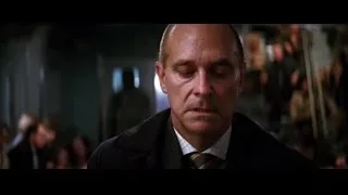 bald man's face in crowded room — Batman: The Dark Knight