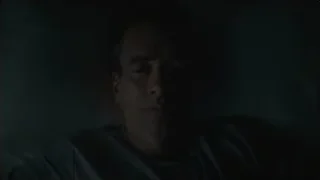 man lying in bed in dark room — Succession