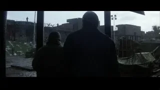 People looking at destroyed building — Batman