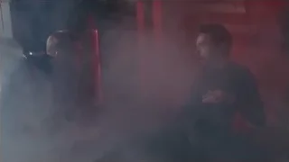 Two men fighting in dimly lit room — The Avengers