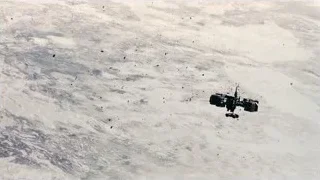 satellite flying over snow-covered landscape — Interstellar