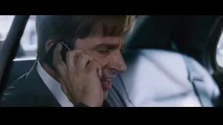 man in car talking on phone — The Big Short