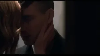 Man and woman embracing in dimly lit room — Peaky Blinders