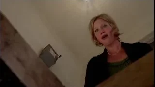 woman looking surprised in dimly lit room — Breaking Bad