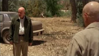 Two men standing in wooded area with car — Breaking Bad