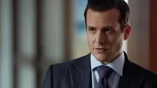 man in suit looking serious indoors — Suits