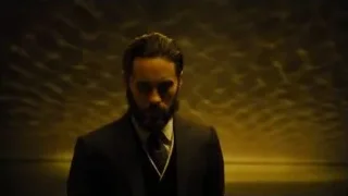man with beard in dimly lit room — Blade Runner 2049