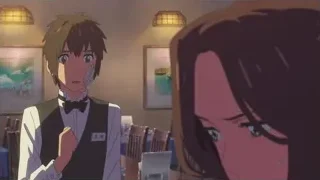 man in tuxedo talking to woman — Your Name