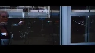 woman with futuristic device at glass door — Iron Man