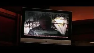 TV screen showing breaking news — Batman: The Dark Knight