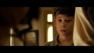 Woman lying on bed, man touching head — Hacksaw Ridge