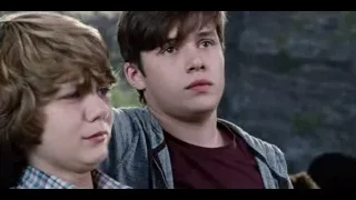 two boys sitting with one sad — Jurassic World