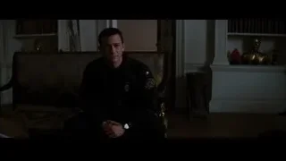 man sitting on couch deep in thought — Batman: The Dark Knight Rises