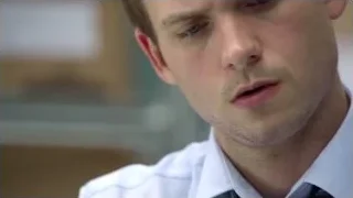 young man deep in thought holding folder — Suits