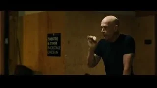 bald man gesturing backstage check-in — Whiplash