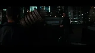 Man in suit on rooftop at night — Batman: The Dark Knight Rises