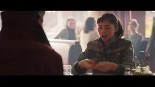 young woman at restaurant table with man — Doctor Strange 2