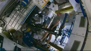 Man working on machine in space station — Elon Musk: Return to Space