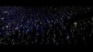 Large crowd gathered in stadium — Creed