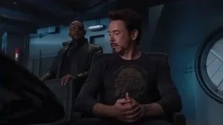 two men looking at computer screen — The Avengers