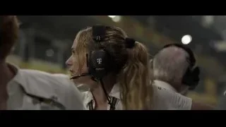 woman wearing headset in control room — F1