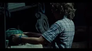 Young boy working with power tool in workshop — Jurassic World
