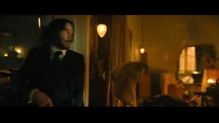 man with gun in dark room — John Wick: Chapter 4