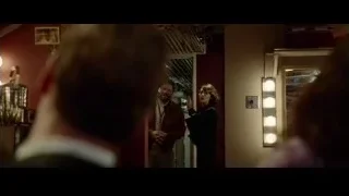 man and woman at mirror in dim room — Steve Jobs