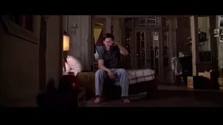 young man reading newspaper on bed — Spider Man 2