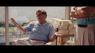 man laughing and gesturing with cards — The Wolf Of Wall Street