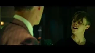 young man holding gun in dimly lit room — The Amazing Spider Man 2