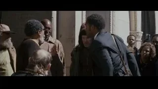 man bending down with boy on street — The Persuit of Happyness
