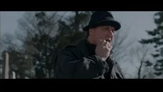 Man kneeling in cemetery — Creed