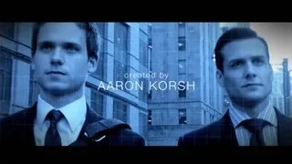 two men in suits by cityscape — Suits