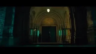 Gothic building entrance with green lights — John Wick: Chapter 4