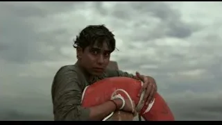 young man holding red lifebuoy — Life of Pi