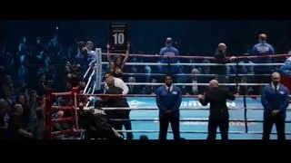 Female boxer in ring holding up sign — Southpaw
